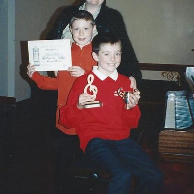 Adam Stanley receives awards for highest marks for Trinity College Exams